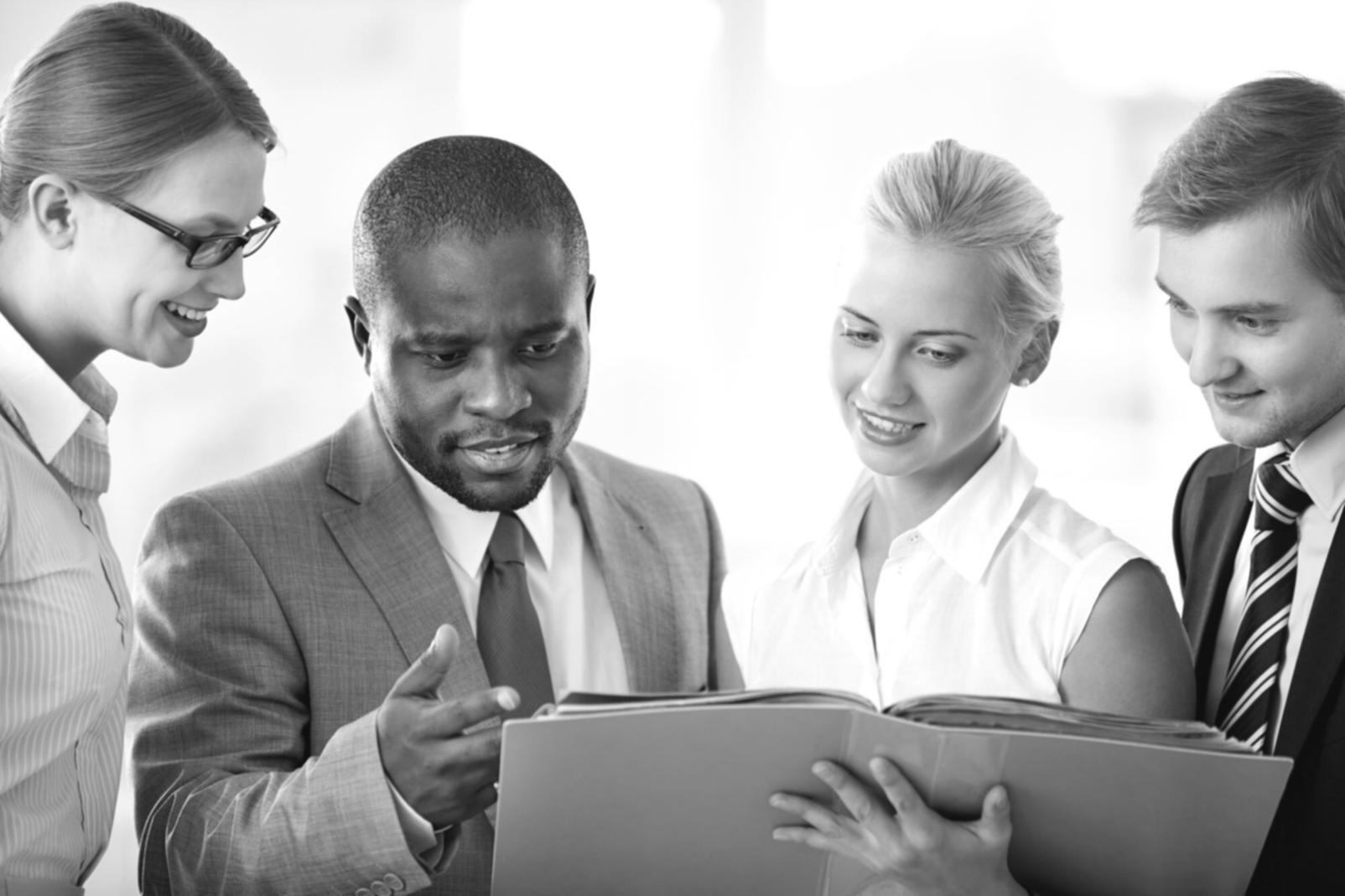 Financial planning materials and calculators spread across desk during study session